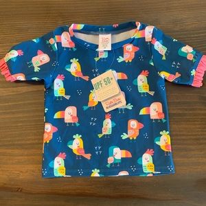 NWT Ruffle Butts Mid-Sleeve Rash Guard. You’re the Tweetest pattern. 2T.
